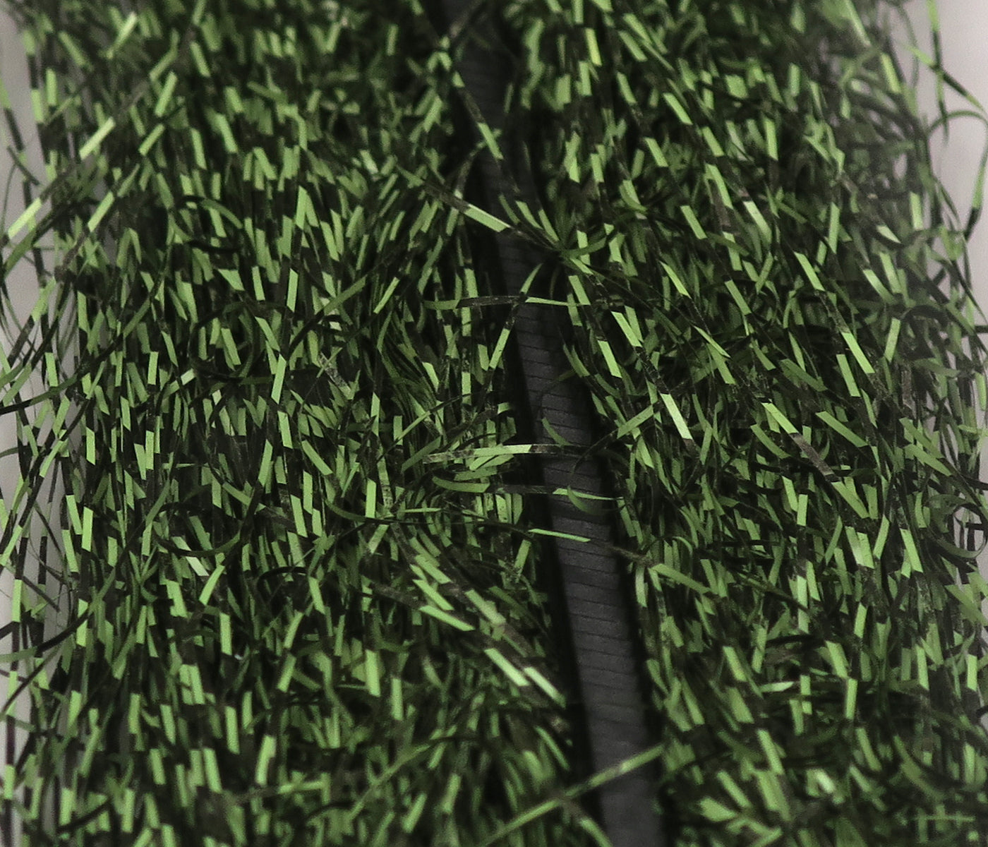 Olive green and black micro barred synthetic fibers, densely packed shiny strands for fly tying