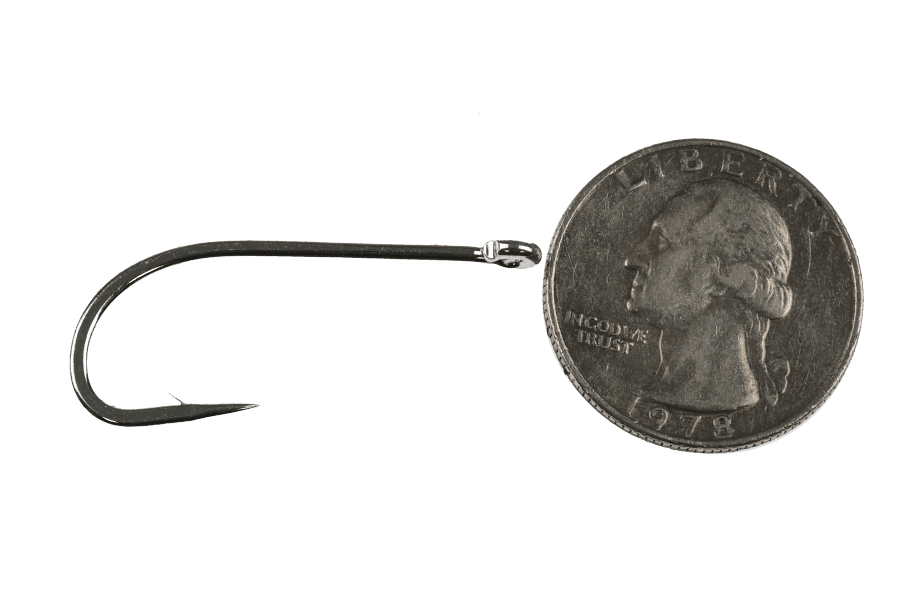 Dark nickel fly tying hook with a long shank and bent eye, shown beside a 1978 Washington quarter for scale against a white