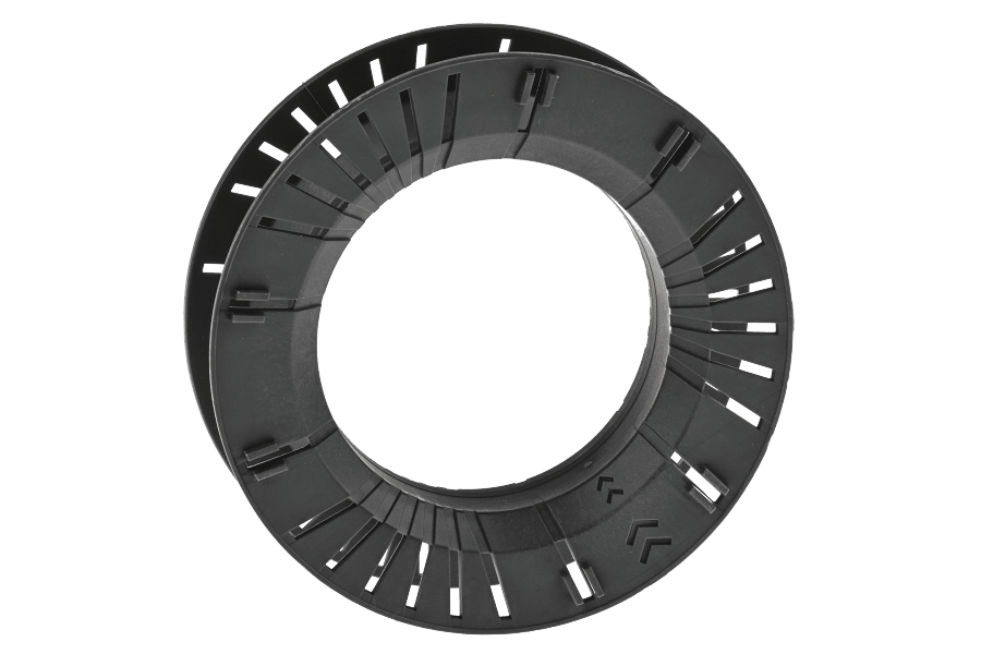Black Greys Pace cassette fly reel spool with open ring design, ventilation slots, and molded plastic frame on white