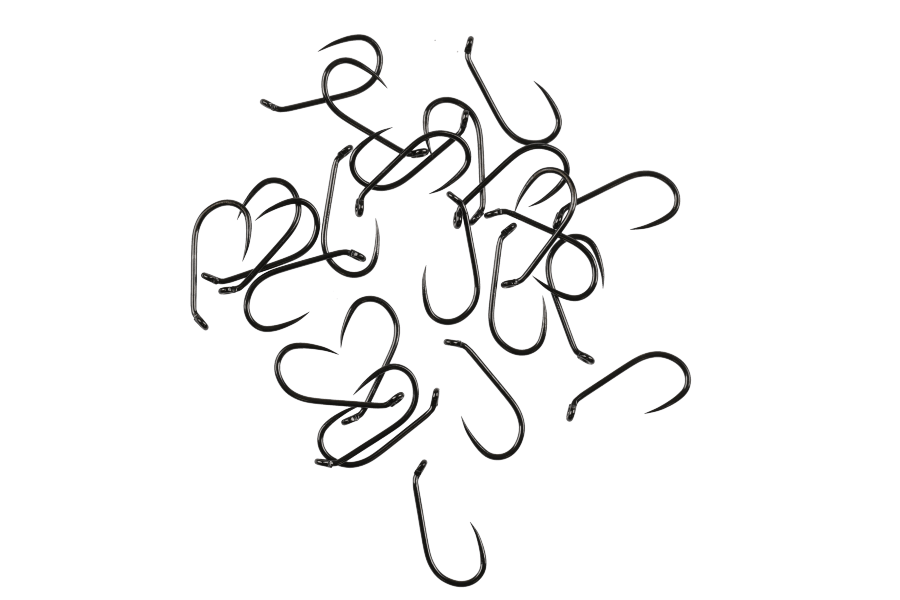 Black Hanak 230BL fly tying hooks scattered on white background, showing curved shanks, barbed points, and dark finish