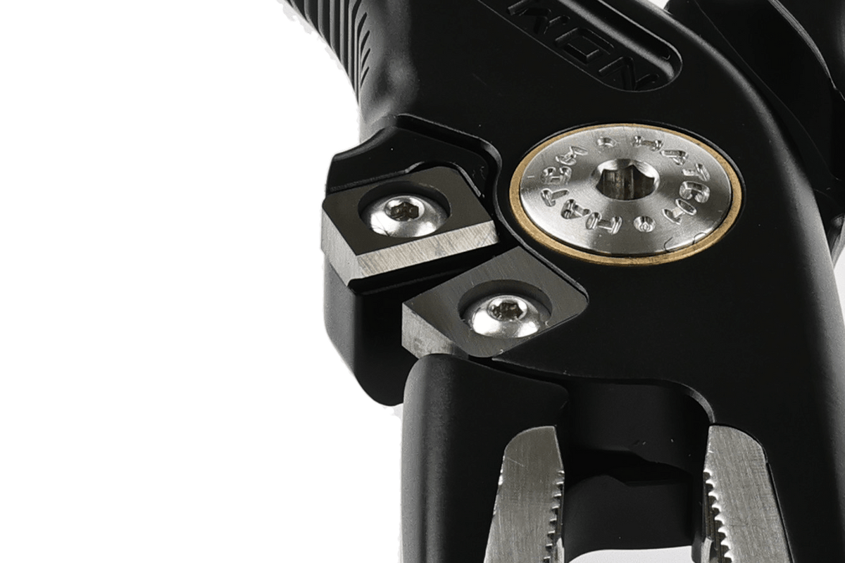 Hatch Nomad 2 black fishing pliers with stainless steel jaws and brass accent detail, close-up view