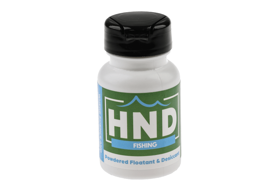 High N Dry powdered fly fishing floatant in a white bottle with black flip-top cap and green label featuring blue waves and
