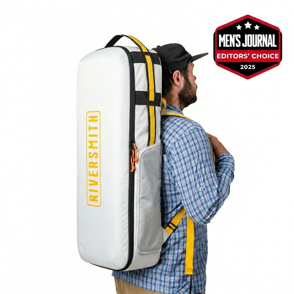 Man wearing white Riversmith fly fishing travel backpack with yellow accents and black straps, featuring brand logo