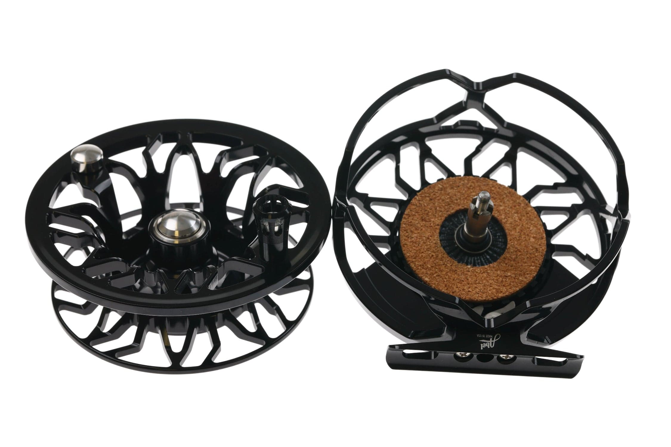 Abel Rove fly reel, black anodized aluminum with skeletonized spool and cork drag disc shown disassembled