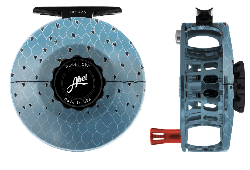 Abel SDF fly reel, patterned sky-blue anodized finish, black drag knob and red handle, open-frame design