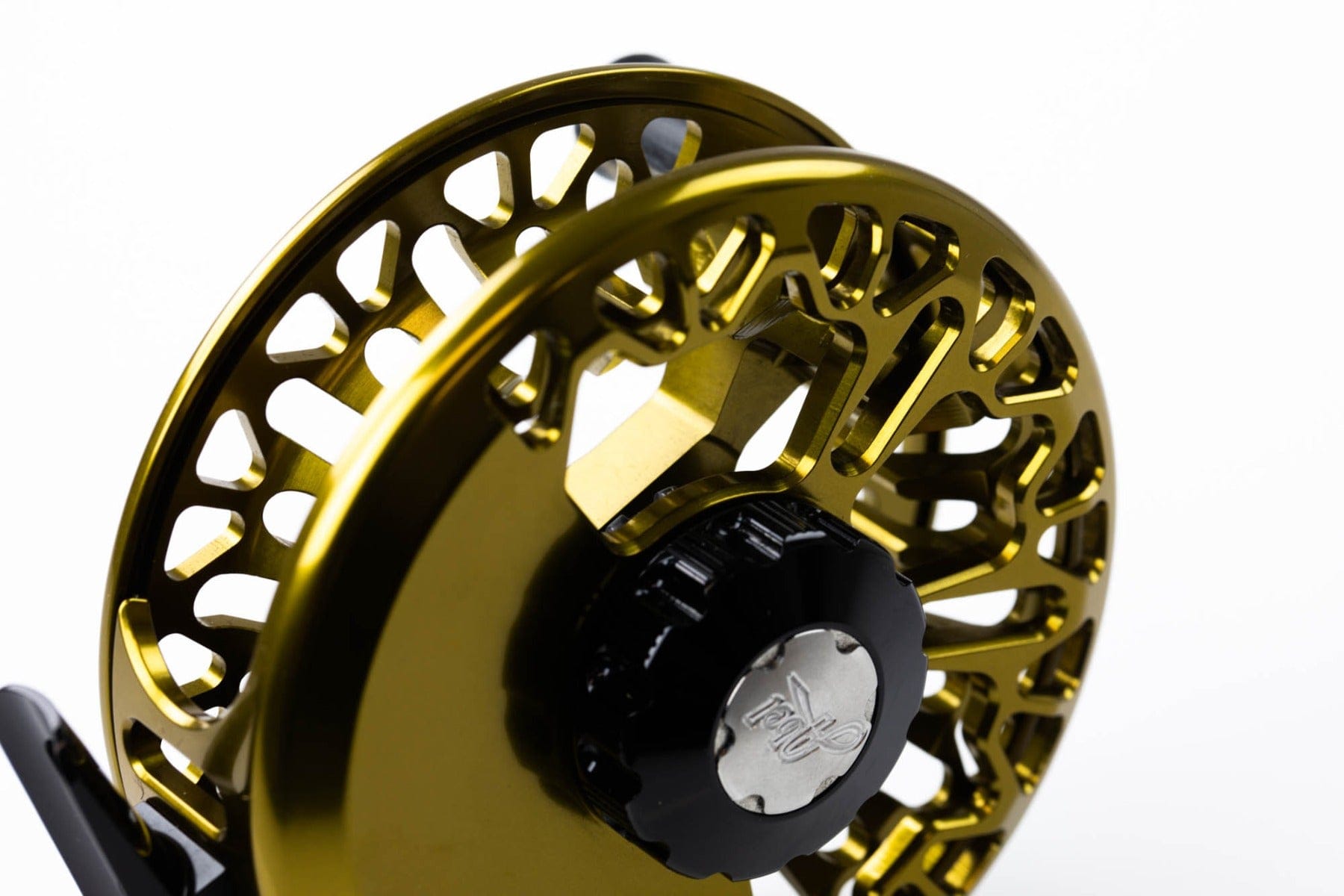 Gold anodized Abel VAYA fly reel with skeletonized aluminum large-arbor spool and black drag knob