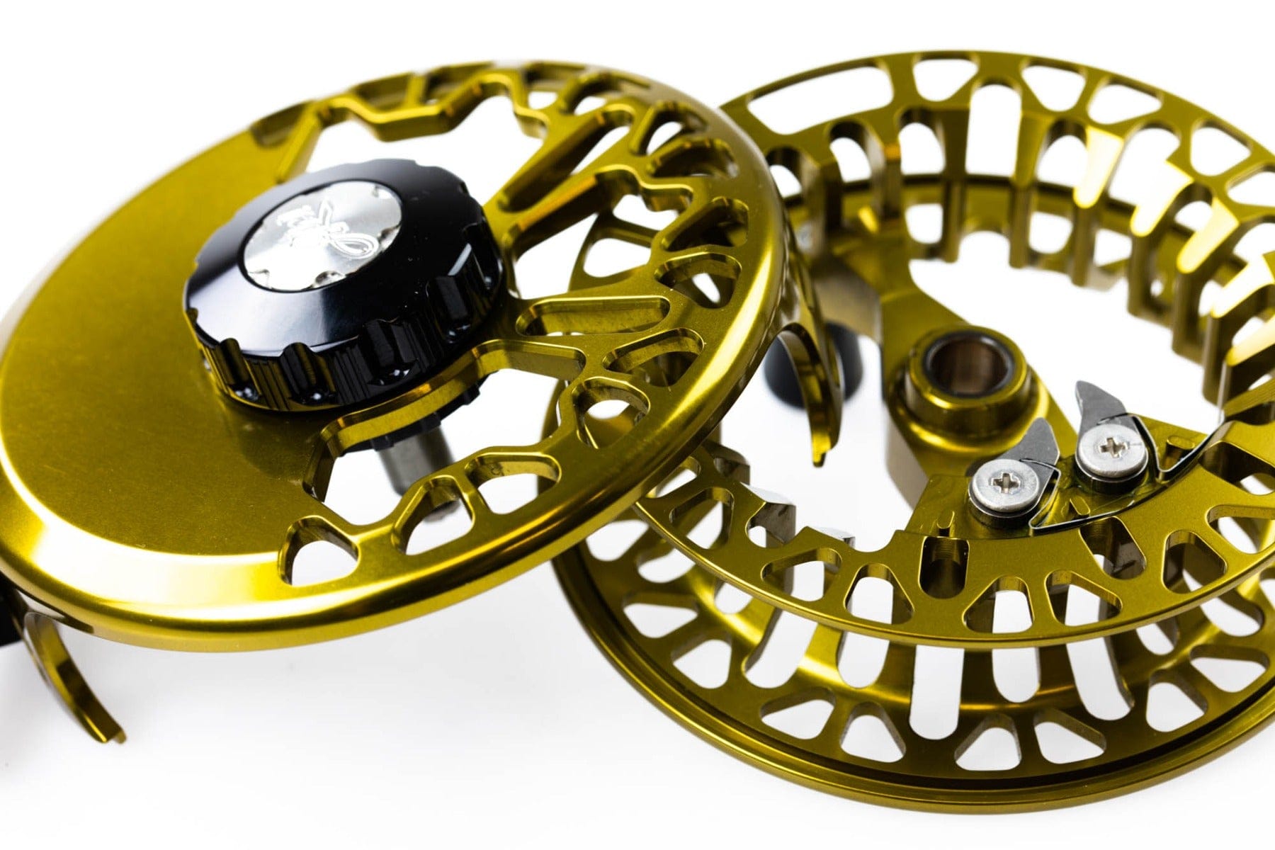 Abel VAYA fly reel close-up showing gold anodized aluminum spool with machined cutouts and black drag knob