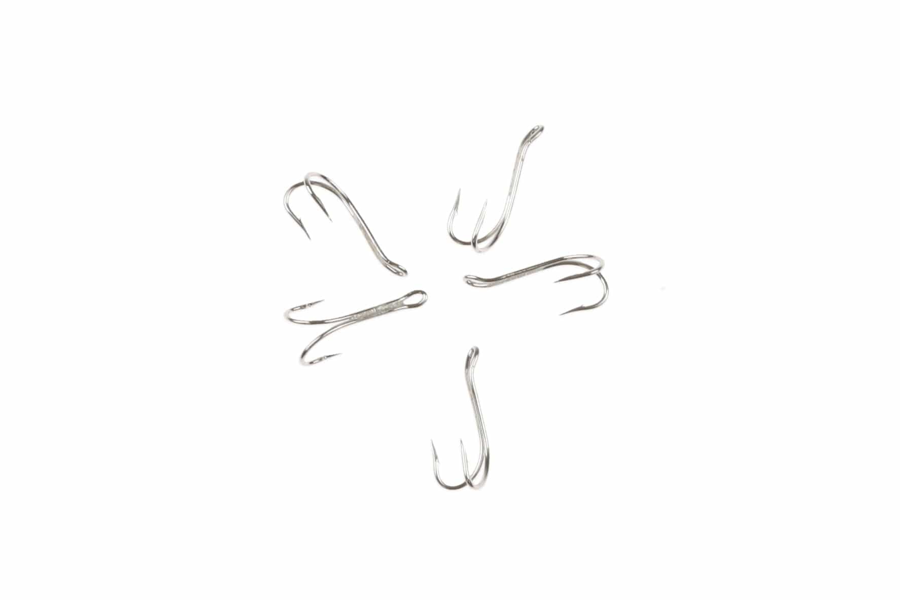 Ahrex silver double fly-tying hooks, polished stainless steel curved shank with two barbed points on white background