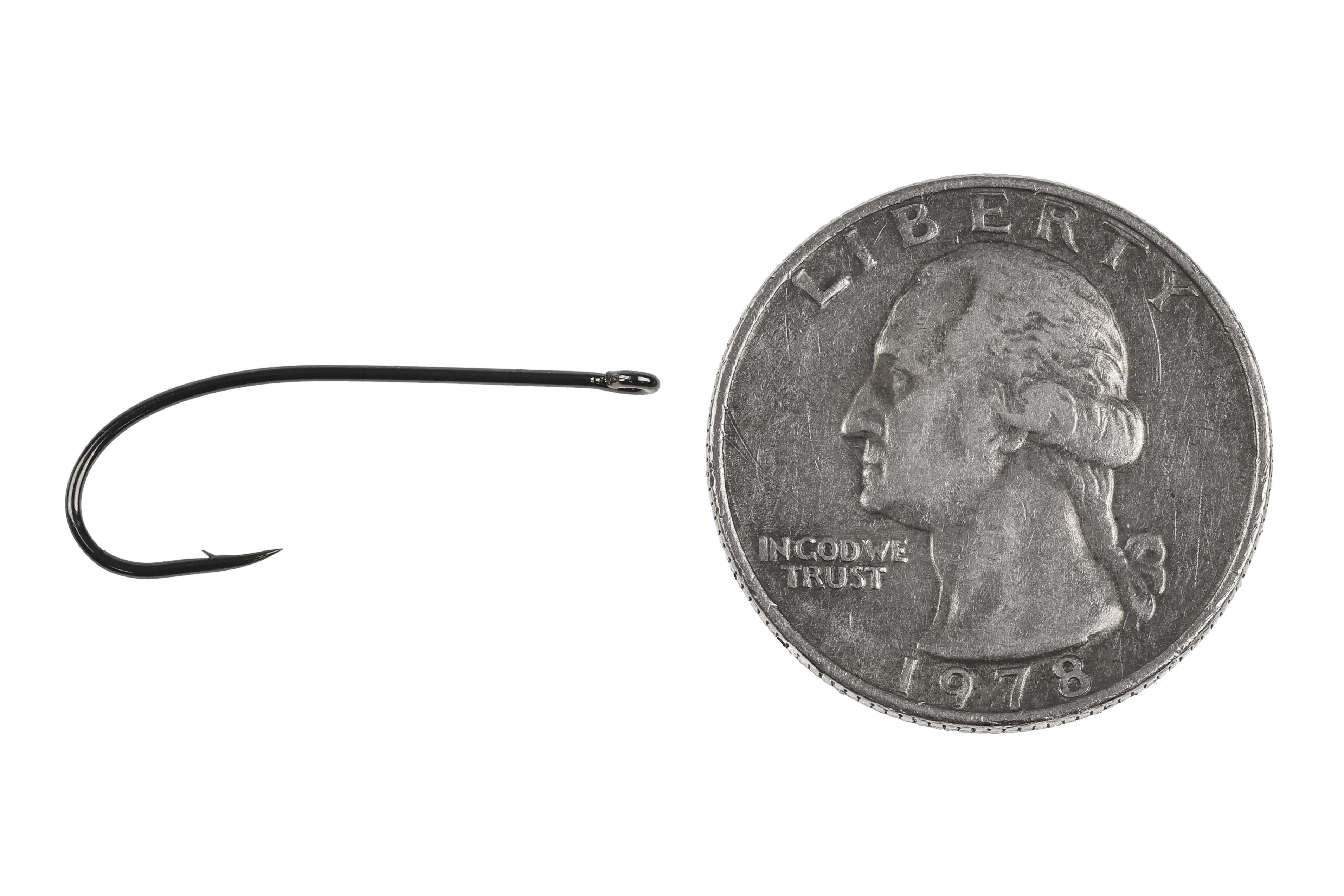 Ahrex FW530 black nickel sedge dry hook with thin curved shank and barb, fly tying hook shown beside US quarter for scale