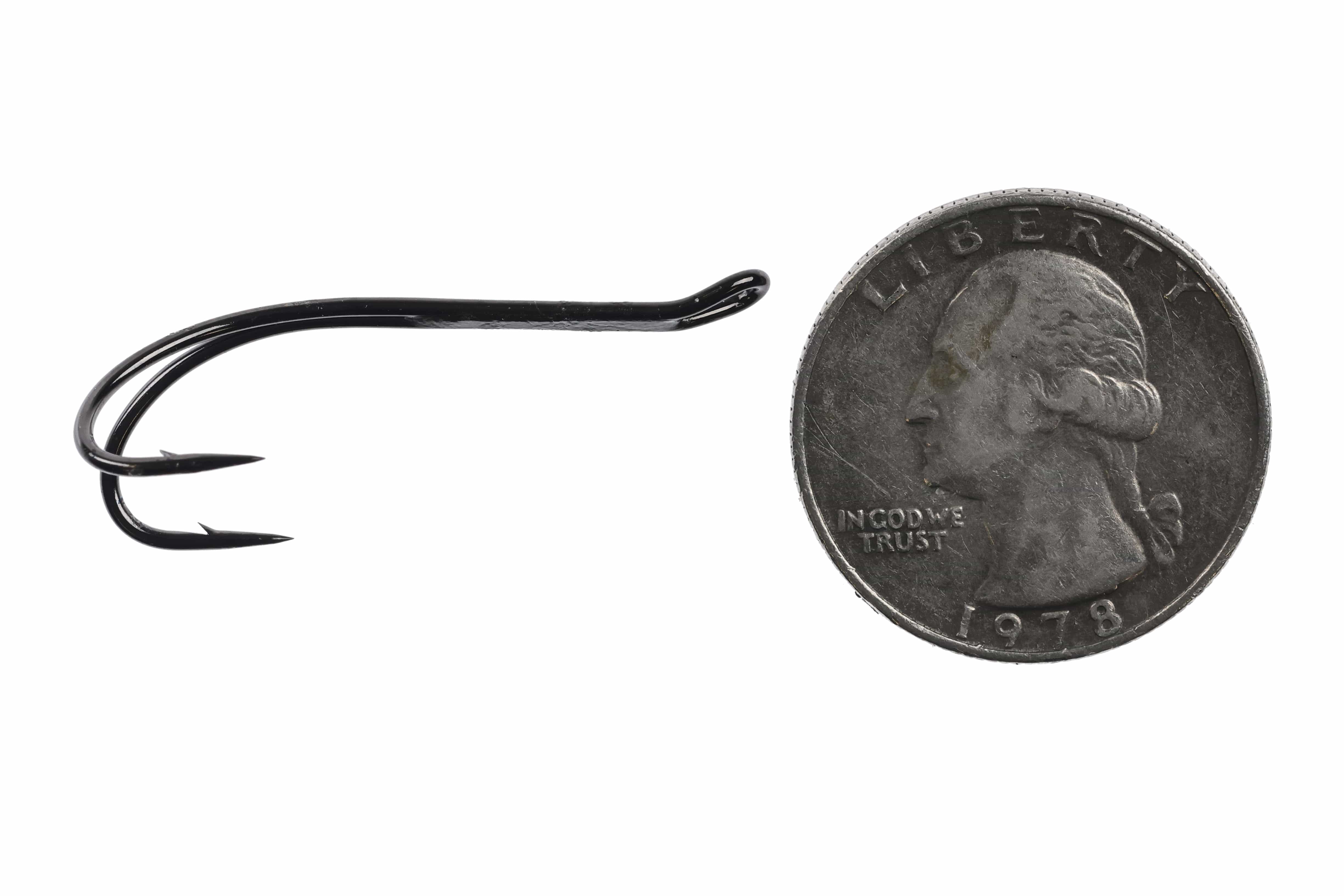 Black glossy Ahrex HR420 progressive double hook with barbed curved shanks and turned eye next to a US quarter for scale