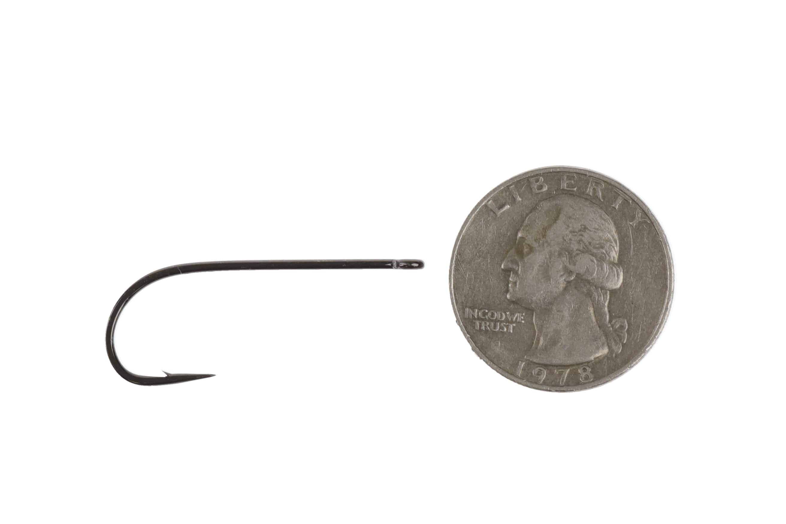 Ahrex black streamer hook, long straight shank and sharp barb, metal finish shown next to US quarter for scale