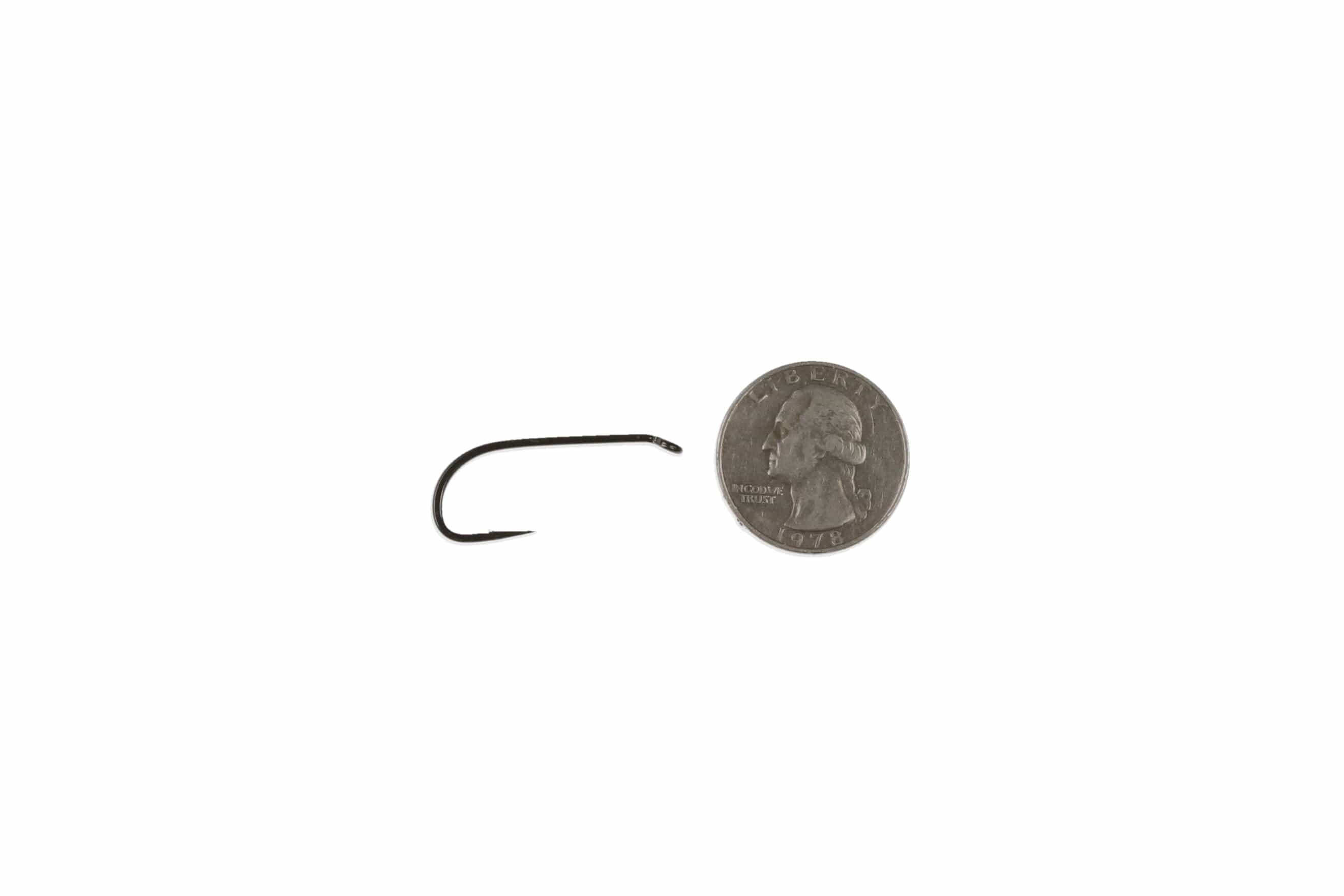 Ahrex NS115 black-nickel deep streamer hook with curved short shank and down eye beside US quarter for scale, fly tying