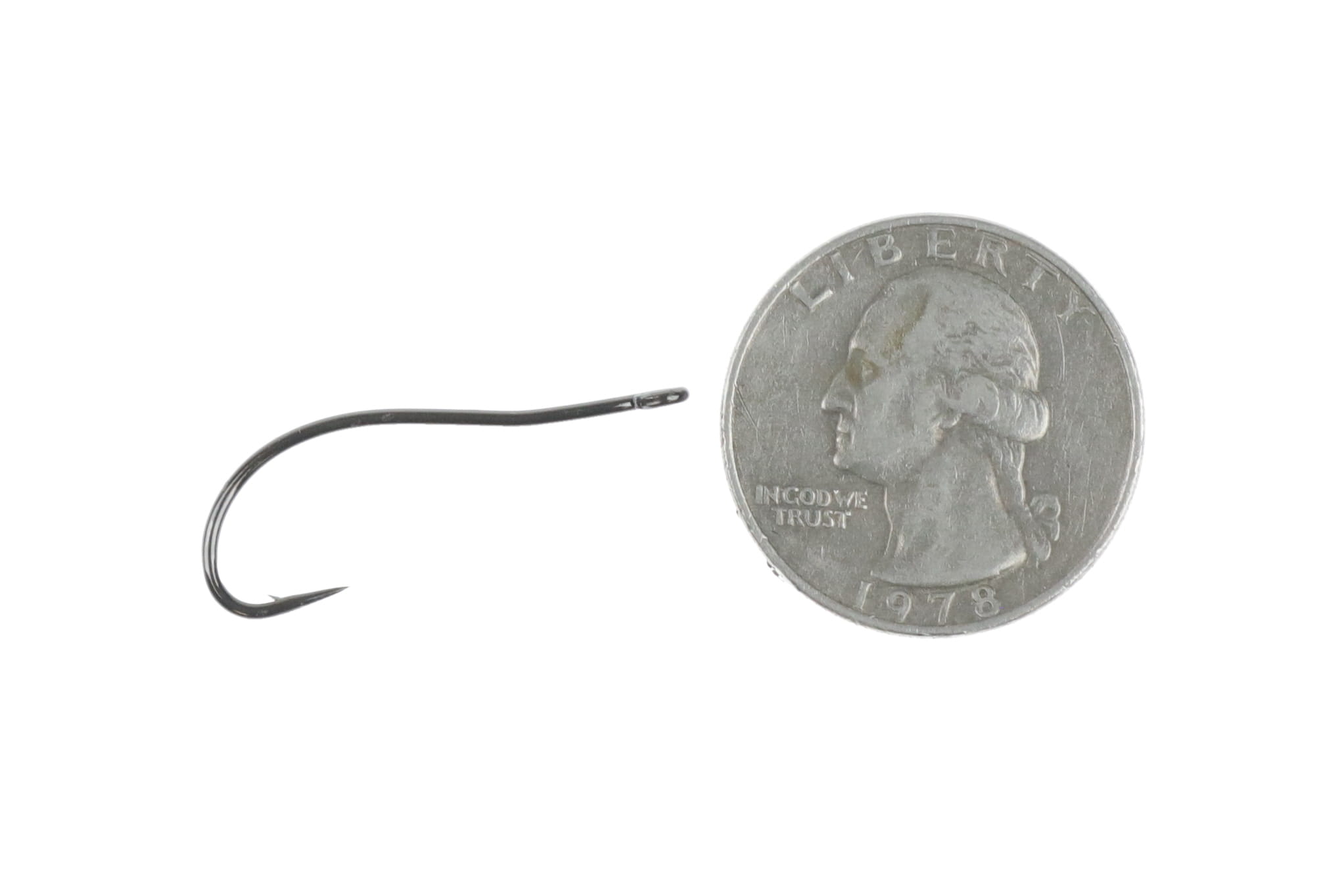 Black nickel curved shrimp hook with eye and downturned point beside US quarter for scale, fly tying hook