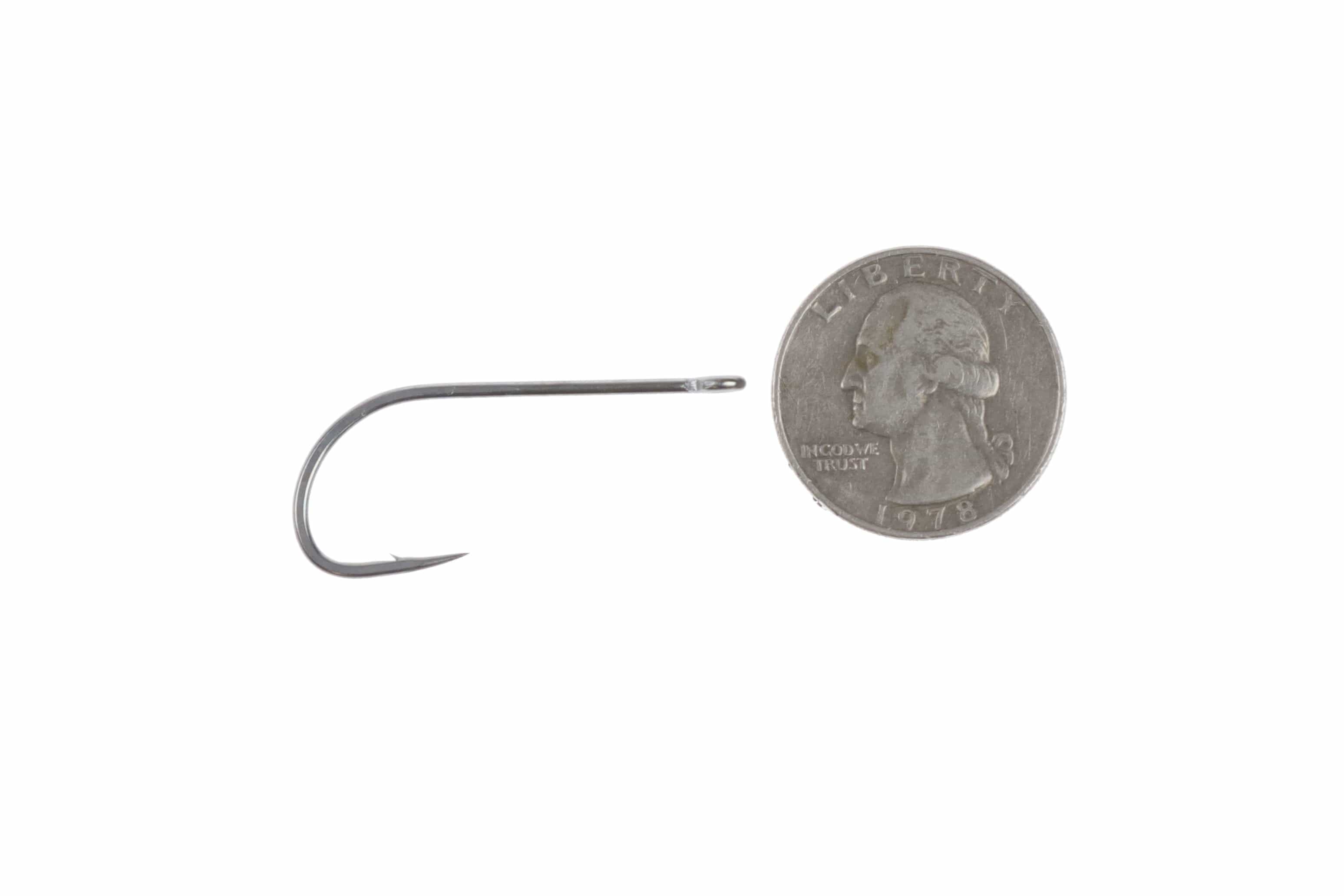 Ahrex SA220 saltwater streamer hook, shiny silver long-shank curved hook with needle point beside US quarter for scale