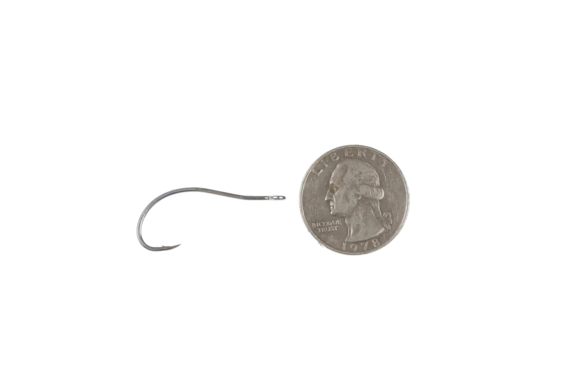 Ahrex SA250 saltwater shrimp hook, silver stainless steel curved shank, needle-eye and sharp point beside quarter for scale