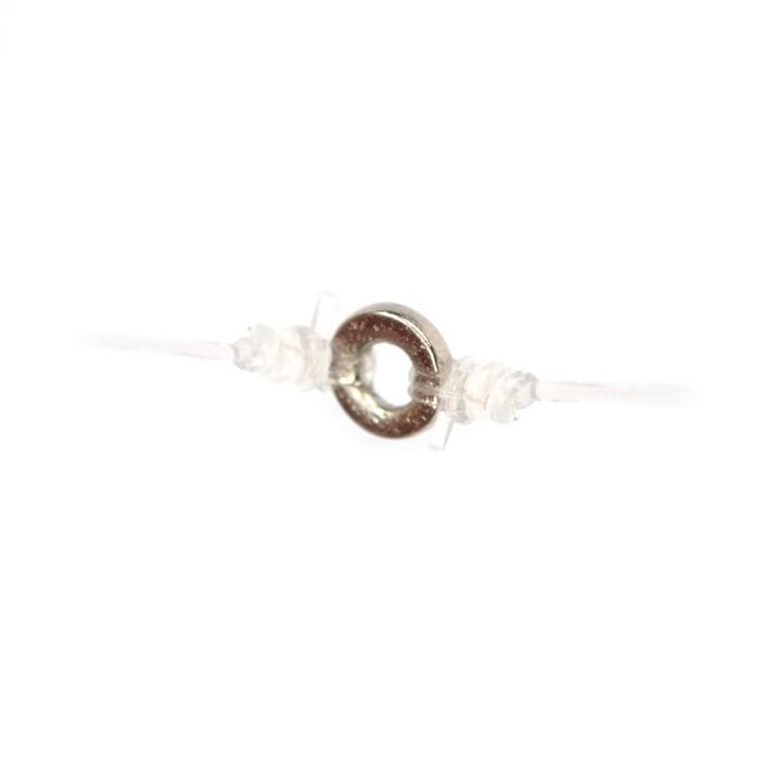 Airflo 2mm micro tippet ring metallic silver threaded on clear monofilament with twin transparent silicone stops