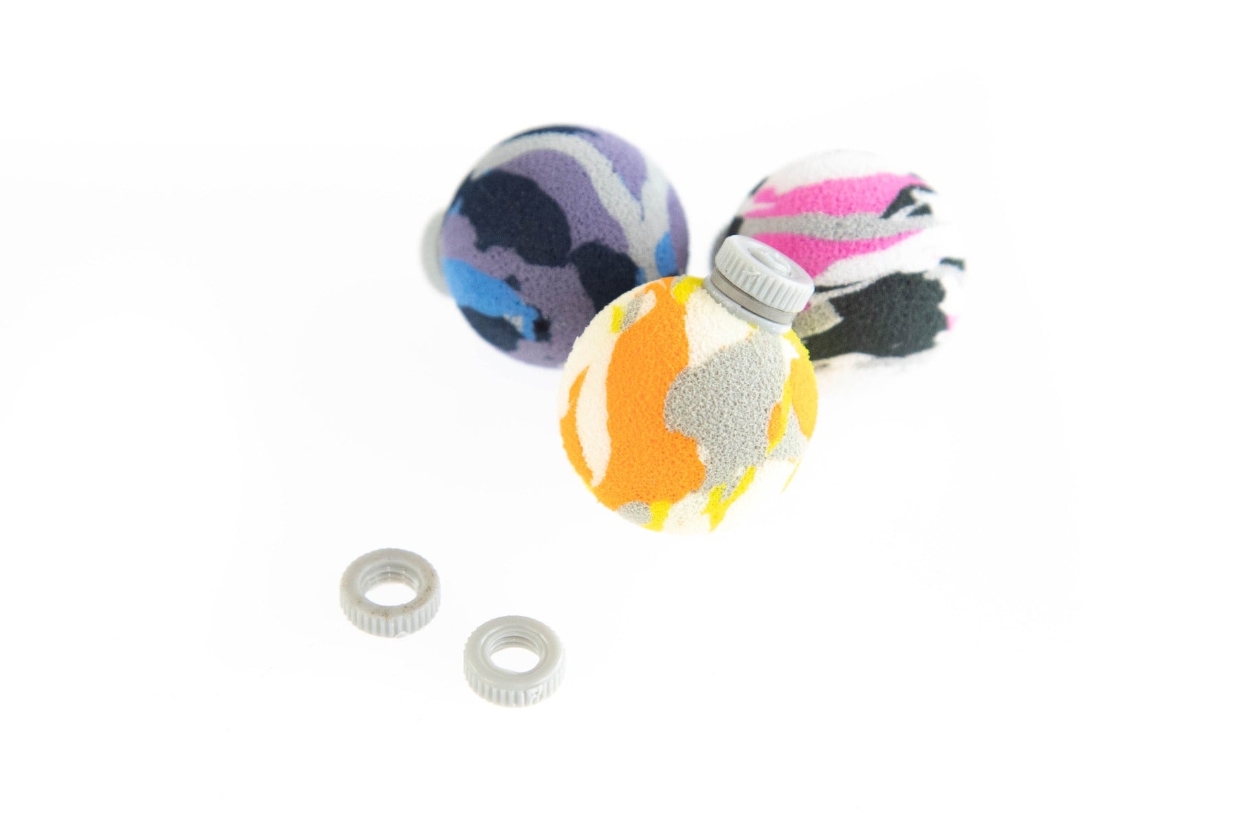 Three Airlock foam strike indicators in camo (orange/gray, purple/blue, pink/black) with two gray screw rings