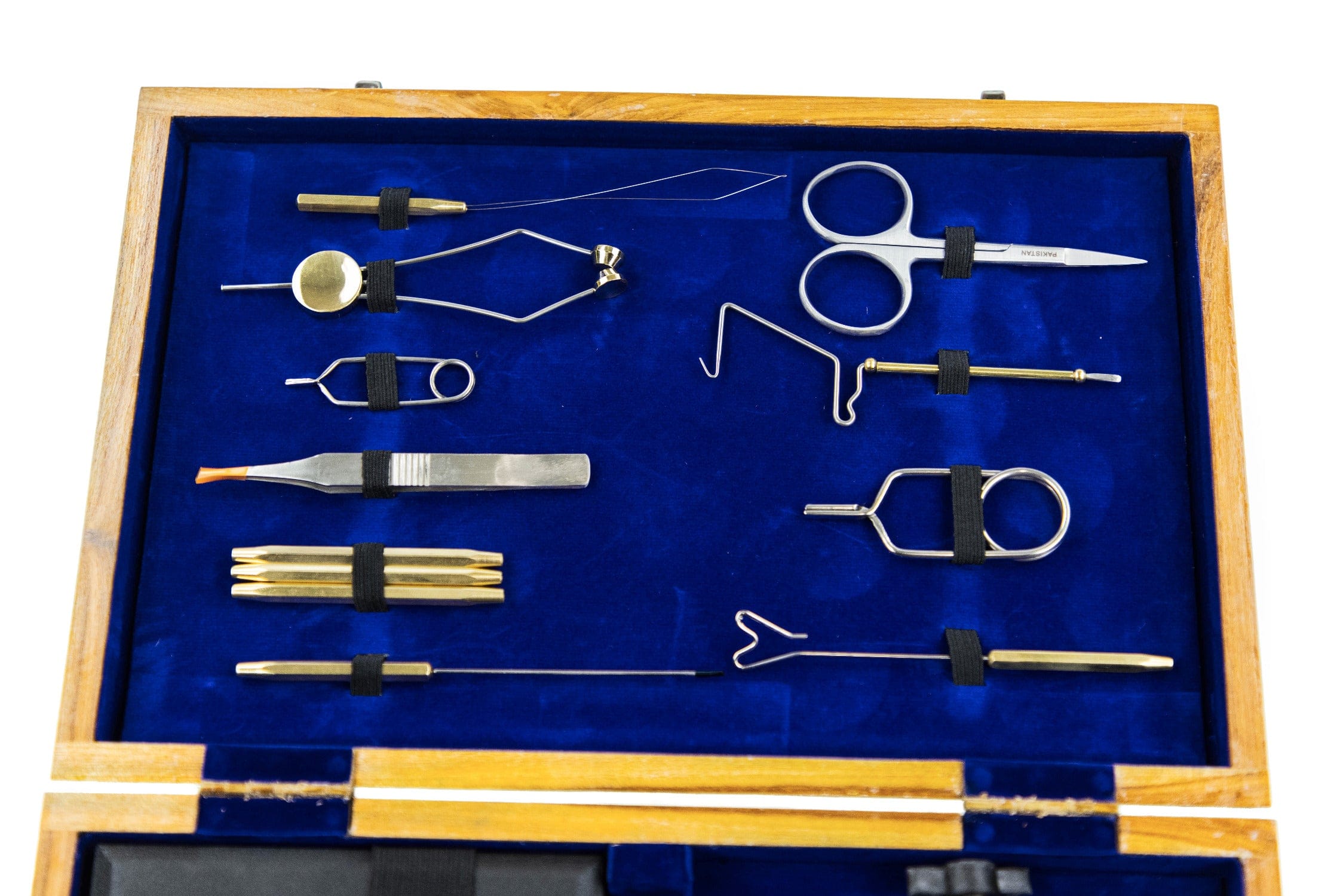 Deluxe wooden fly tying kit with brass and steel tools arranged on blue velvet inside a light wood box