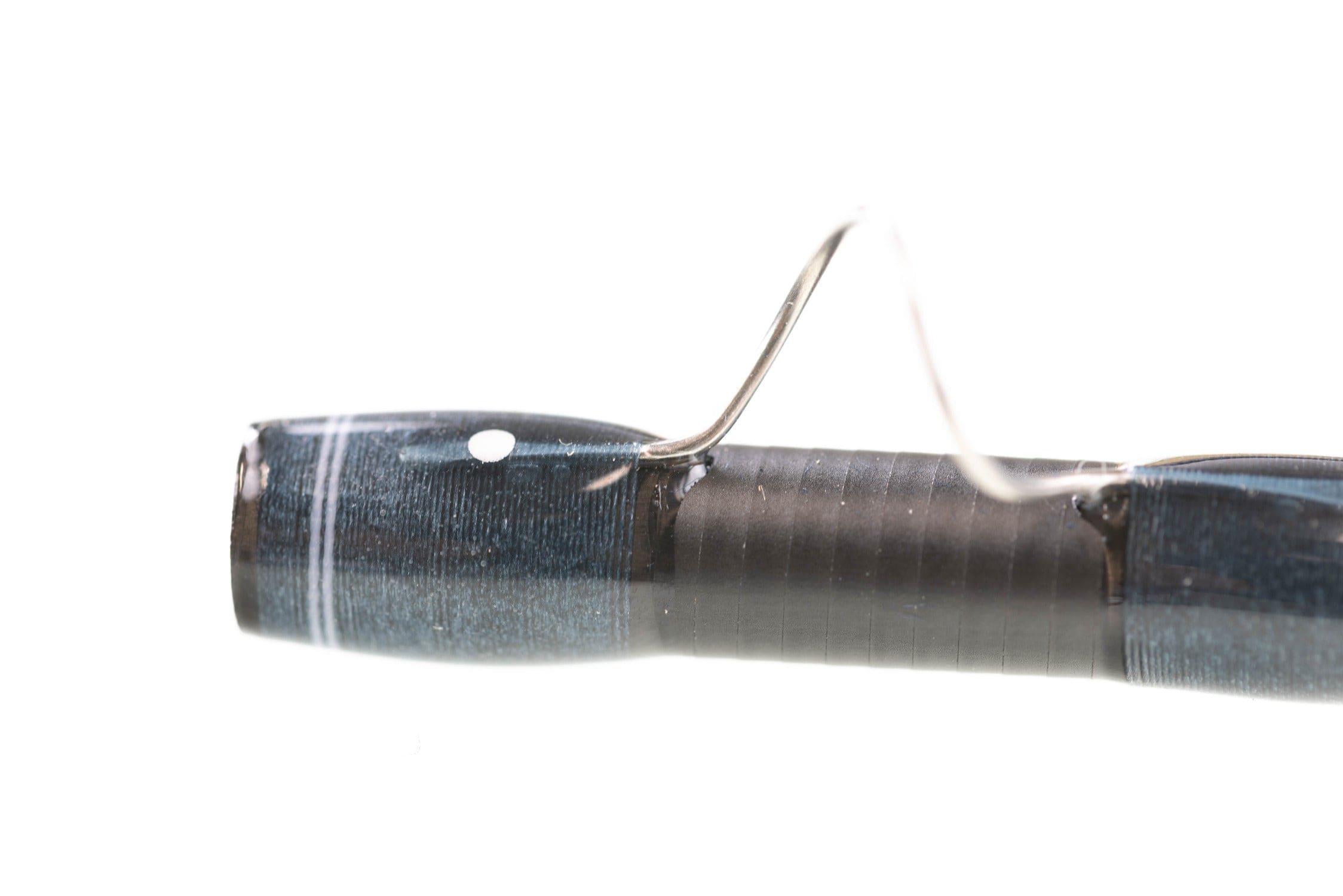 Atlas Signature 9ft 8wt fly rod showing blue metallic blank, black thread-wrapped handle and silver guide foot
