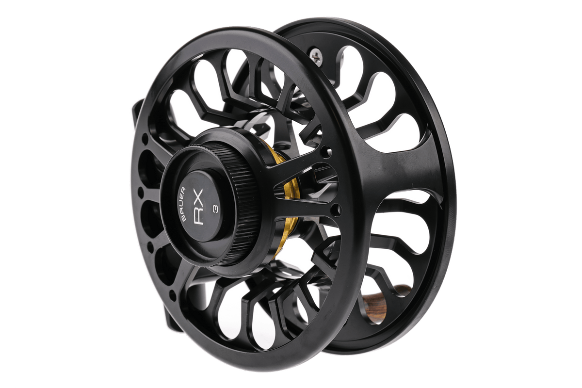 Bauer RX black anodized aluminum large-arbor fly reel with machined spokes, gold drag accent and wooden handle