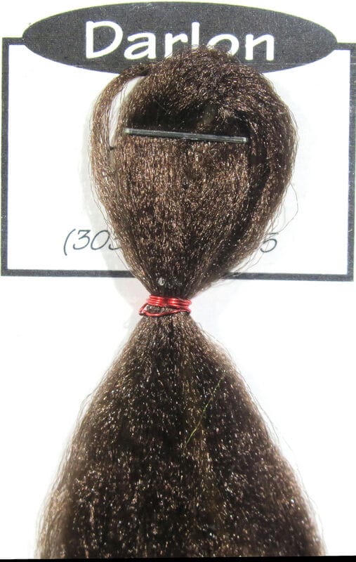 Dark brown Darlon synthetic hair bundle with subtle sparkle, tied with red wire and black clip on white fly tying card