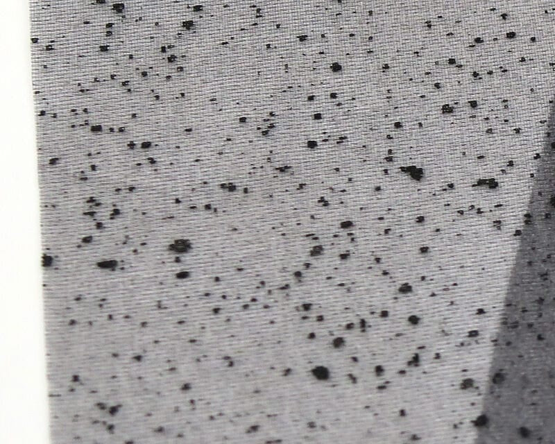 Gray mottled synthetic wing material with black speckled web pattern for fly tying