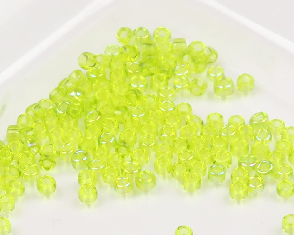 Chartreuse transparent glass fly tying beads, small round seed-style beads with center holes, glossy finish