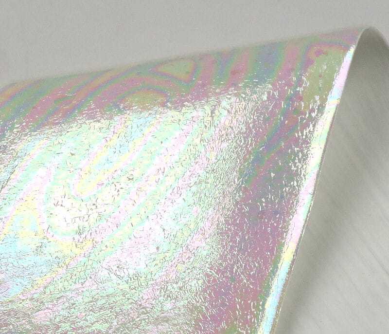 Iridescent UV Chewee fly tying skin, glossy holographic pearlescent sheet with pink-green-blue shimmer and crackled texture