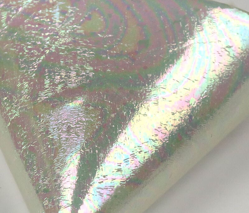 Iridescent pearlescent UV Chewee Skin sheet with holographic rainbow sheen and crinkled foil texture for fly tying