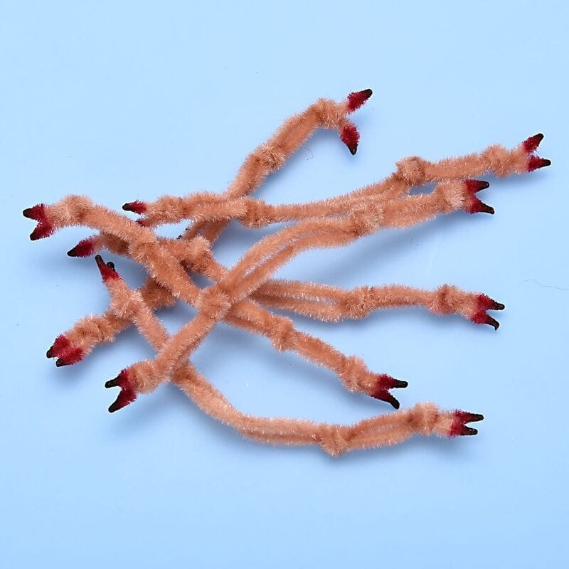 Peach fuzzy Enrico Puglisi crab claws fly tying chenille with red-tipped ends on pale blue background