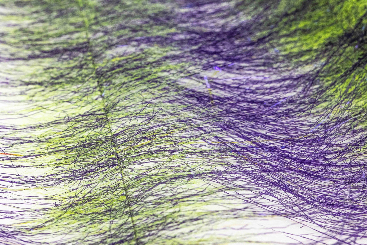 Enrico Puglisi Craft Fur close-up showing layered chartreuse and purple synthetic fur fibers for fly tying