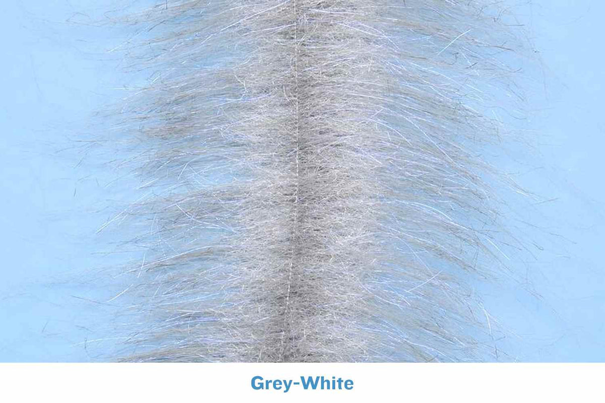 Grey-white Enrico Puglisi craft fur brush strip with dense center seam and wispy synthetic fibers for fly tying