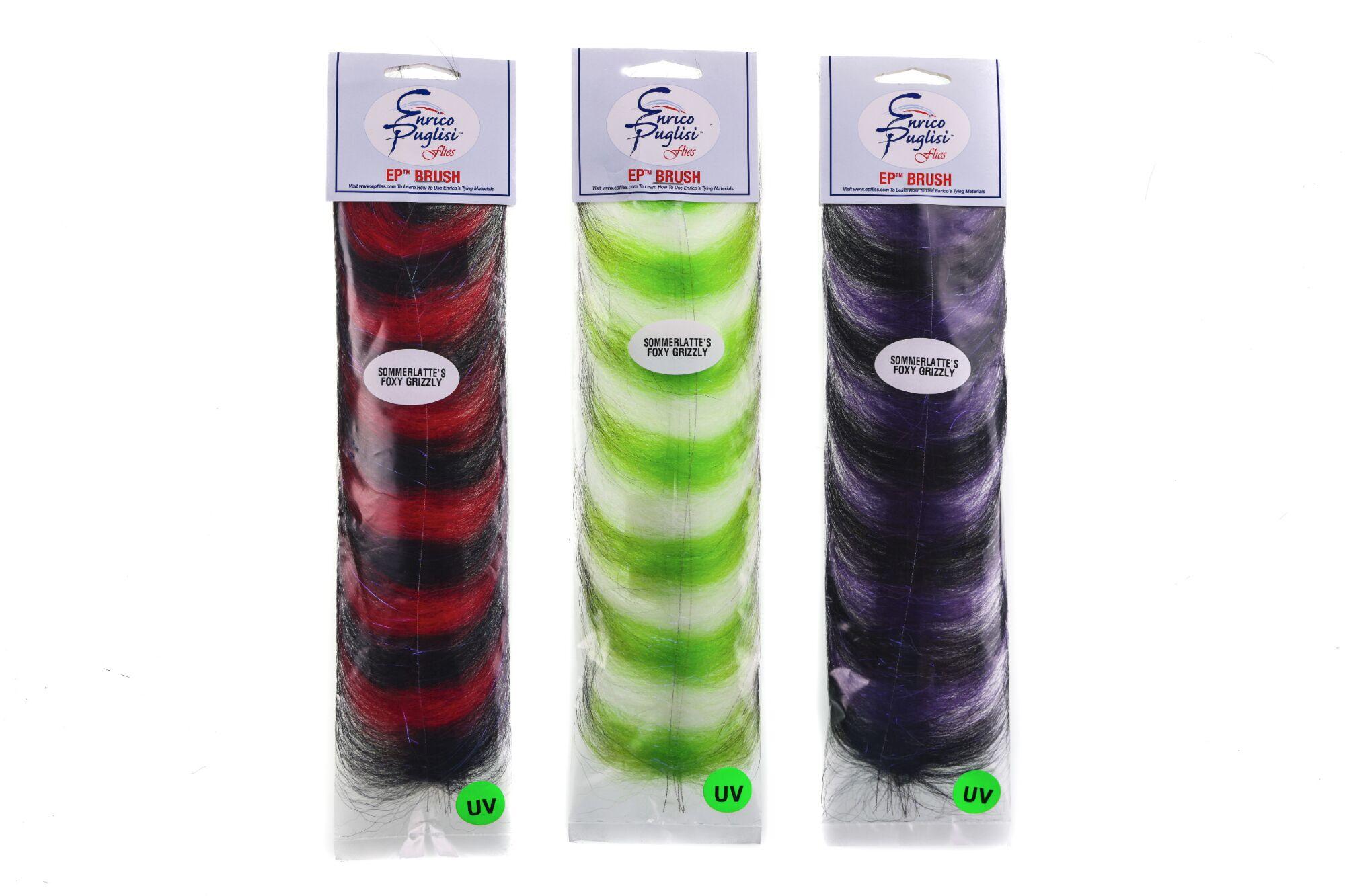 Three Grizzly Foxy Brush packs with striped synthetic fibers in red/black, chartreuse/white and purple/black for fly tying