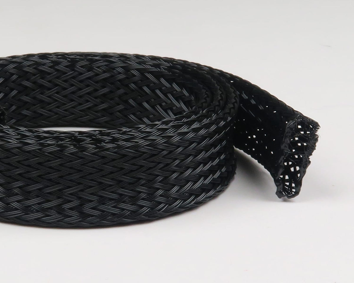 Black braided Fish-Skull body tubing coiled roll with glossy woven nylon texture for fly tying