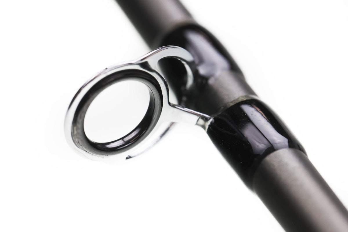 Greys Lance fly rod close-up: chrome guide ring and glossy black carbon blank with metal guide foot