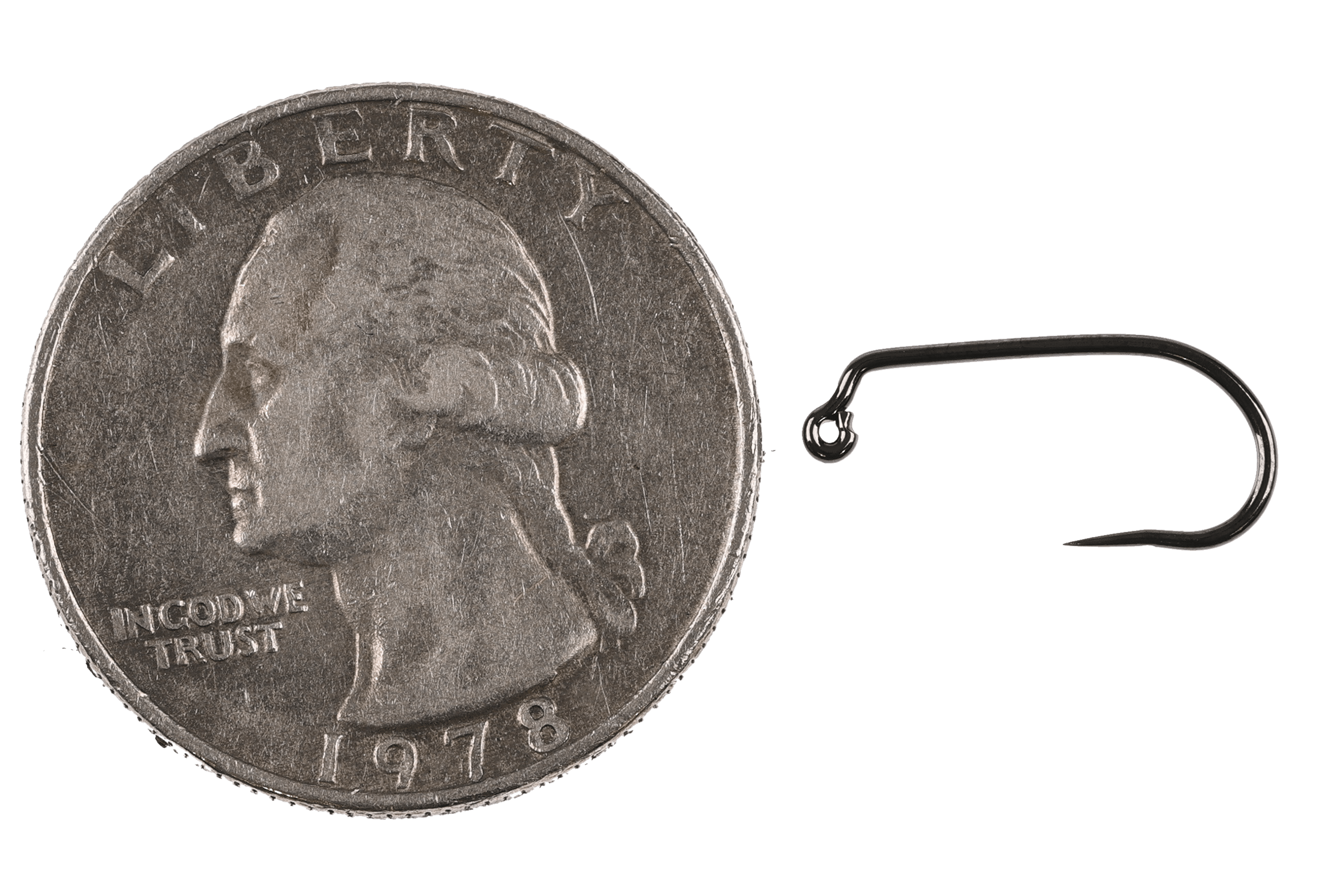 Black nickel Hanak 470BL jig wave hook, dark glossy curved shank with upturned eye beside US quarter for scale, fly tying