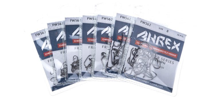 Ahrex FW562 short barbed nymph hooks in clear packs showing black nickel hooks for fly tying