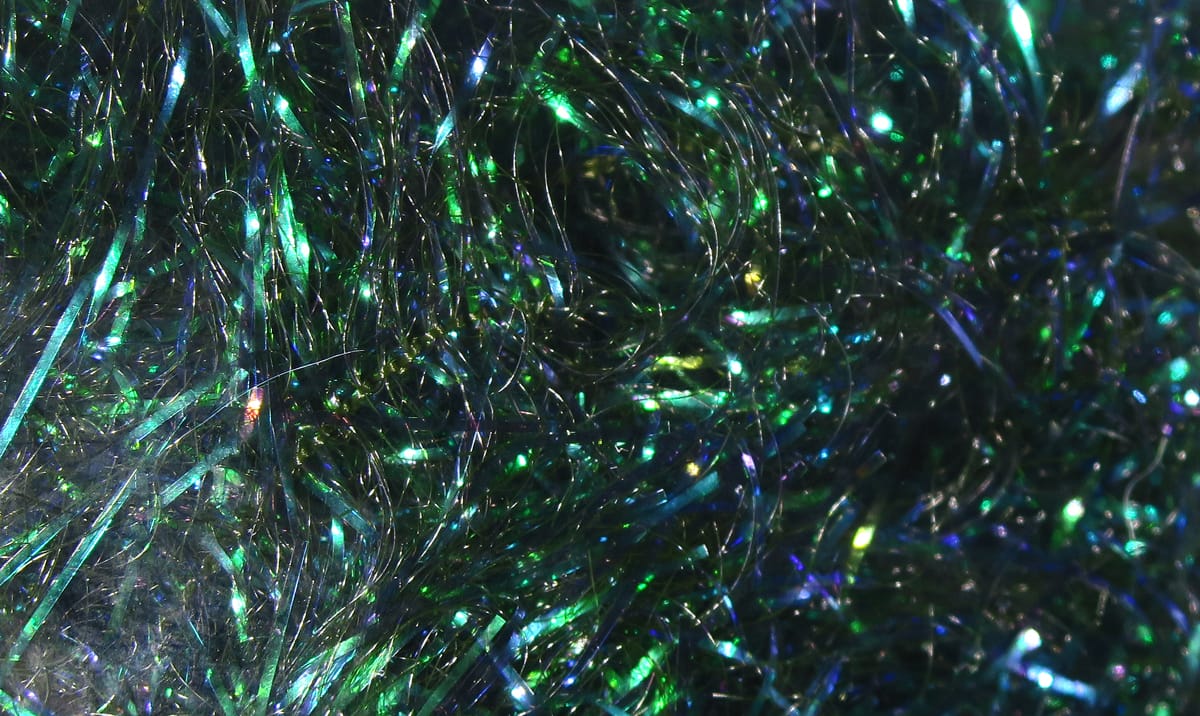 Iridescent green and blue synthetic flash fibers for fly tying, tinsel-like filler with reflective shimmer