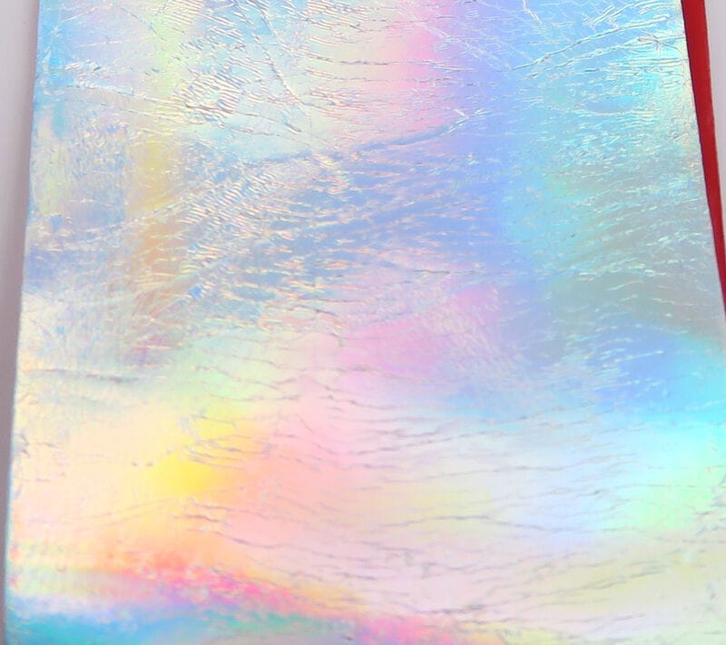 Iridescent holographic Sili Skin sheet with pastel rainbow sheen and subtle wrinkled texture for fly tying