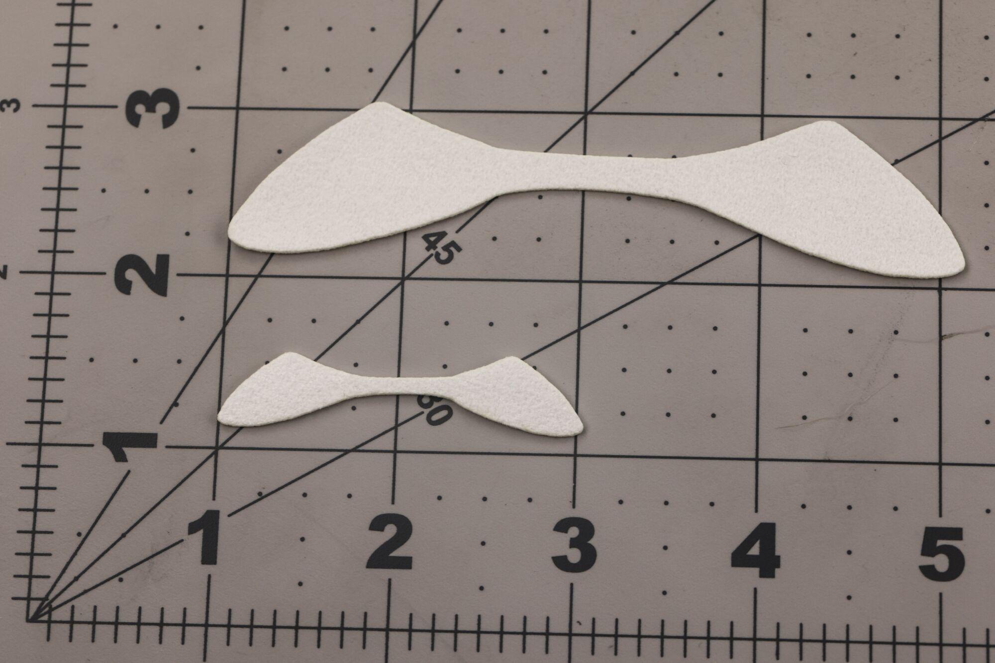 White foam Cohen's Minnow fins, tapered minnow-style fly tying material on gray grid cutting mat