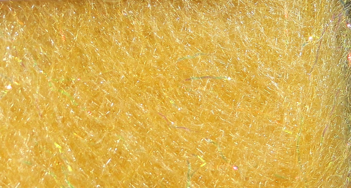 Golden yellow synthetic dubbing for fly tying with fine iridescent strands and fluffy fibrous texture (Bruiser Blend)