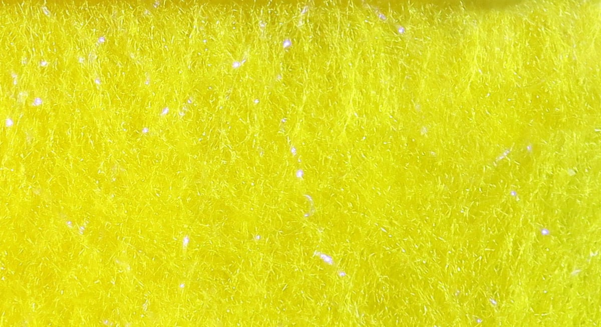 Bright chartreuse yellow Bruiser Blend dubbing fibers with fine synthetic texture and subtle iridescent sparkle for fly tying