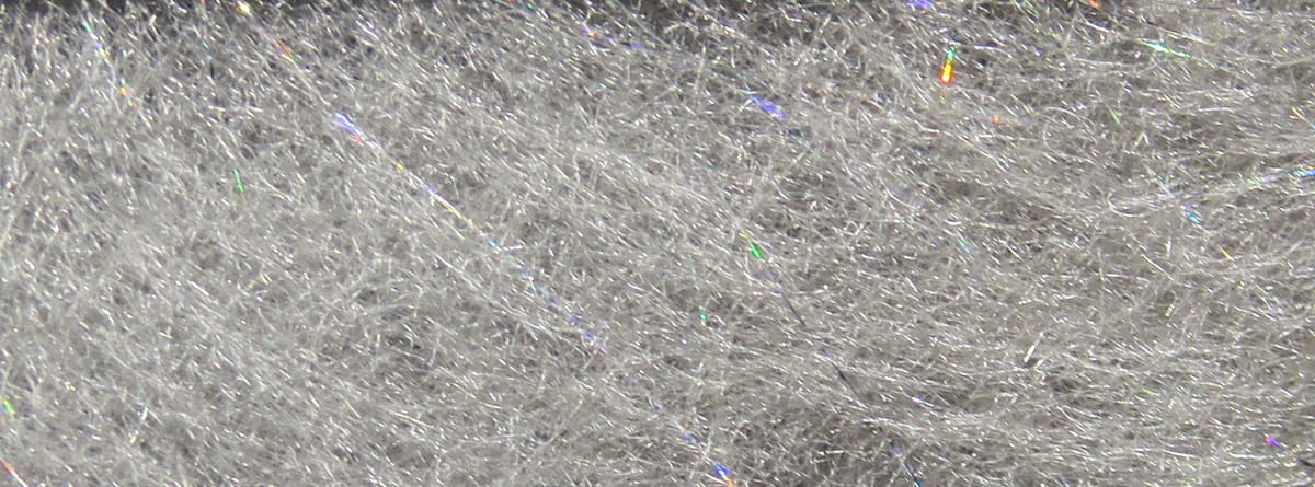 Light silver synthetic Hareline Jr. Bruiser dubbing with fine iridescent flash fibers for fly tying