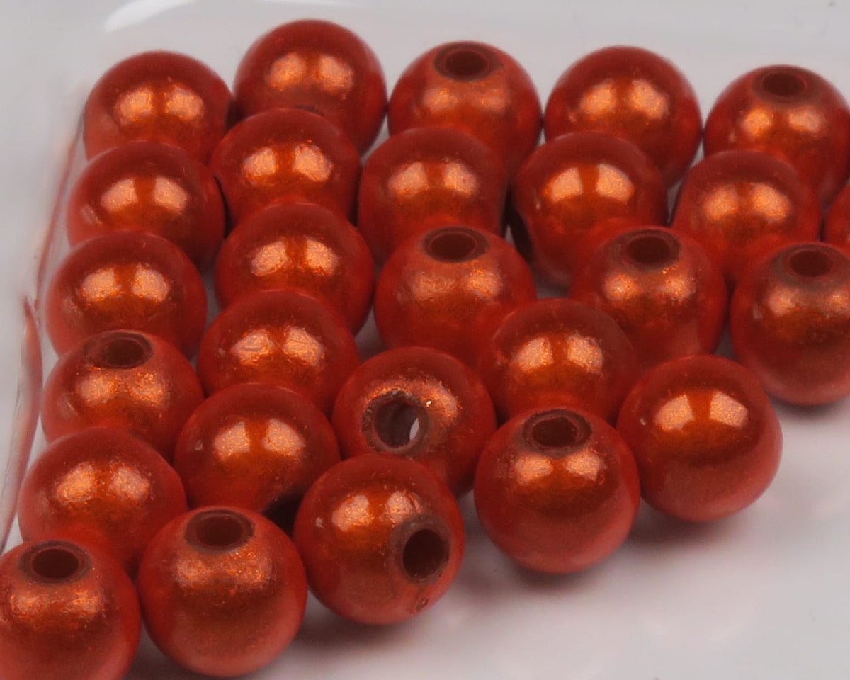 Hareline 3D Beads metallic orange pearlescent round fly-tying beads with large center holes and glossy finish