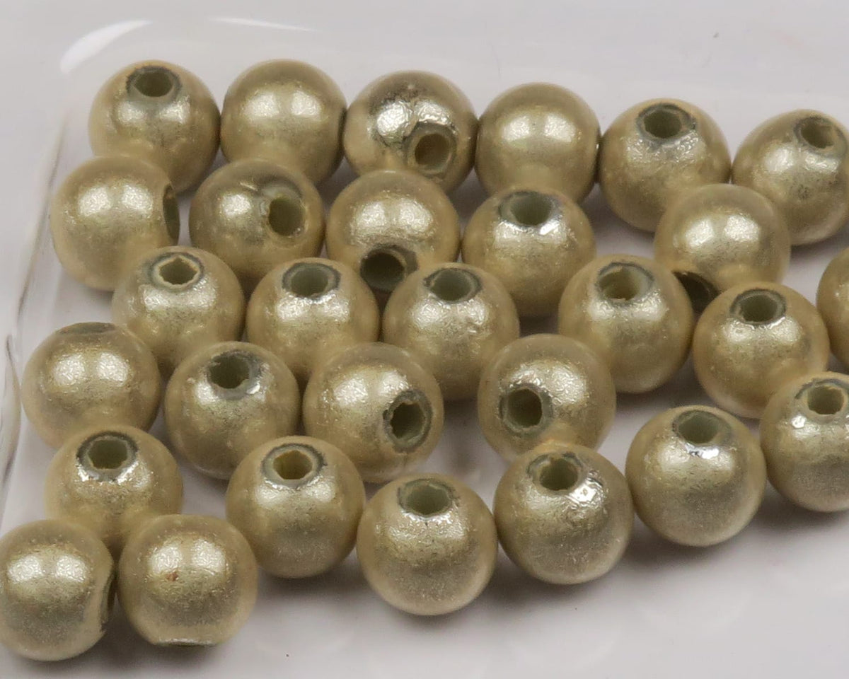 Hareline 3D small round metallic light-gold beads with center holes, pearlescent textured finish for fly tying