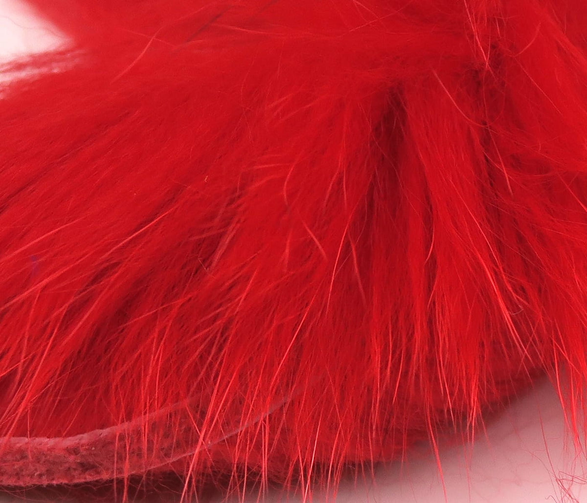 Bright red Hareline Arctic Fox zonker strips, soft long fur for fly tying streamers
