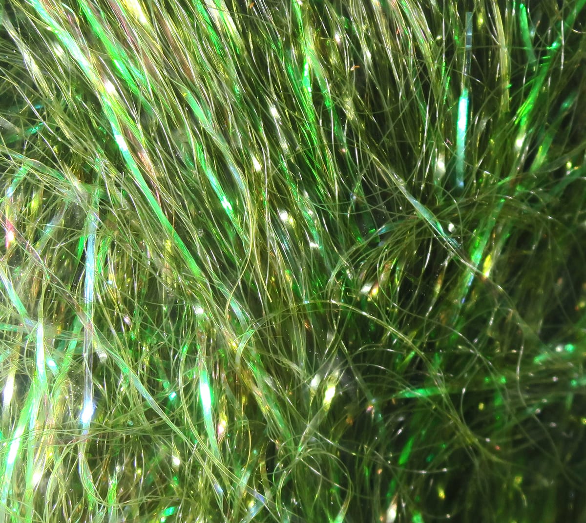 Iridescent olive-green synthetic flash fibers with fine translucent strands and metallic sheen for fly tying baitfish flies