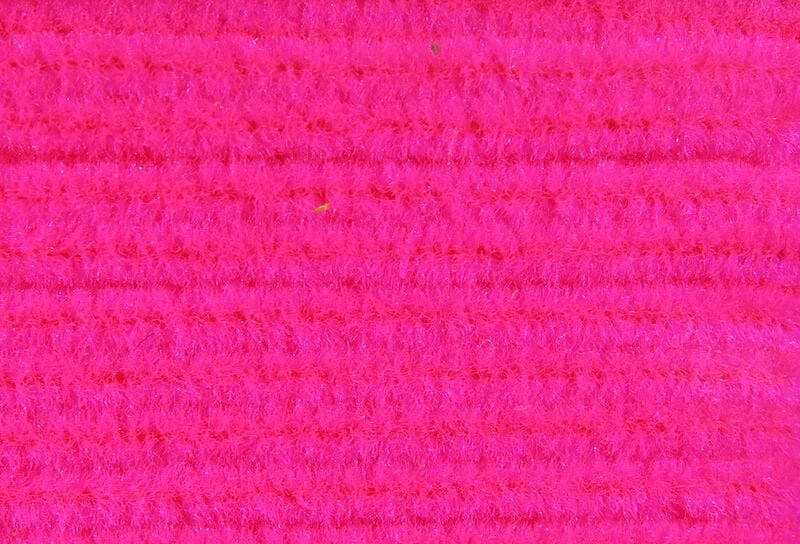 Hareline chenille in fluorescent hot pink, fuzzy ribbed synthetic yarn with subtle sparkle for fly tying and lures