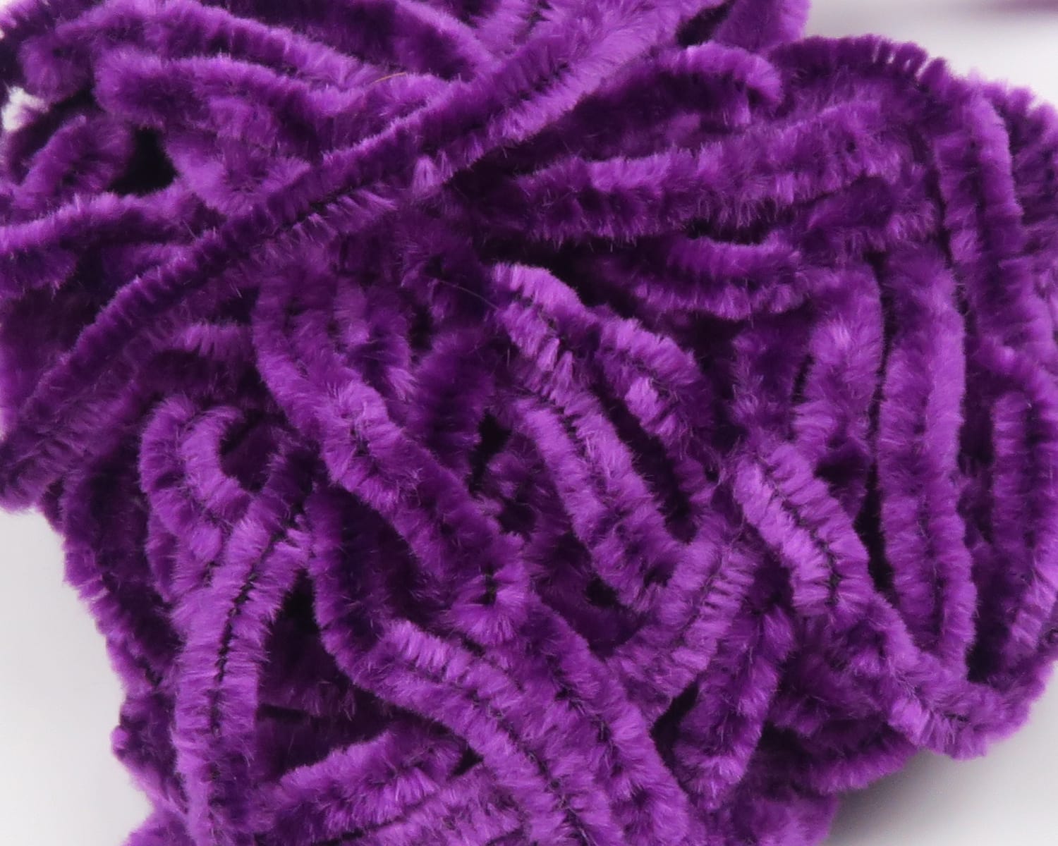 Hareline chenille in vivid purple, plush fuzzy material with dense pile for fly tying and craft bodies