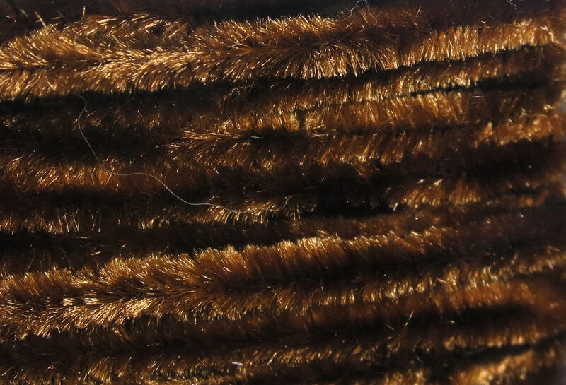 Dark brown metallic Hareline chenille strands with dense fuzzy fibers for fly tying
